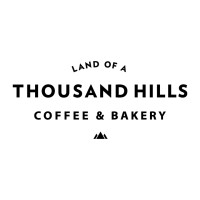 Land Of A Thousand Hills Coffee & Bakery - Cypress logo