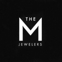 The M Jewelers logo