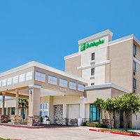 Holiday Inn Dallas DFW Airport Area West logo