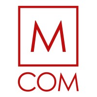 M COM logo